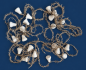 Preview: Gold colored tinsel garlands with spun cotton bells,  ca. 30s, ca. 560 cm long
