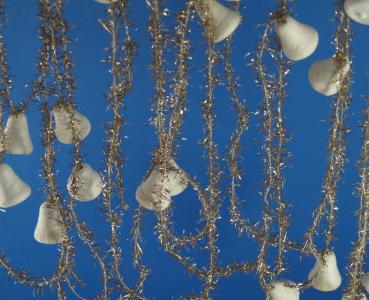 Gold colored tinsel garlands with spun cotton bells,  ca. 560 cm
