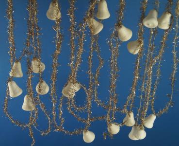 Gold colored tinsel garlands with spun cotton bells,  ca. 560 cm