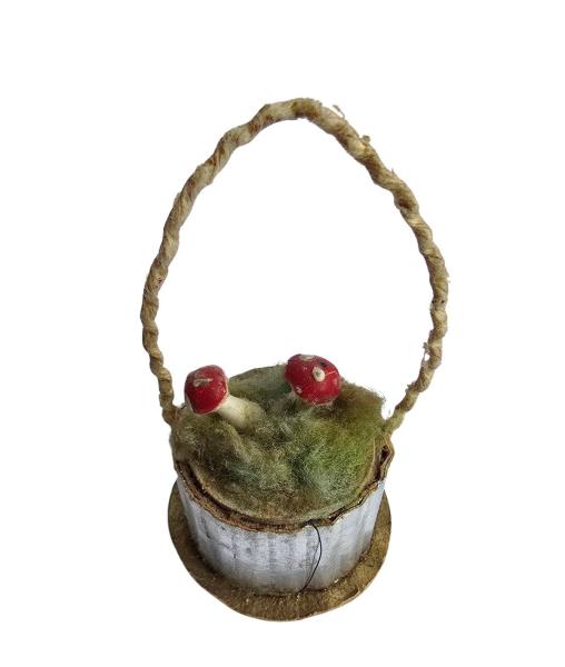 Basket with mushrooms around 1920